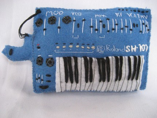Illustration for article titled Miniature Synthesizer Replicas Cast in Felt Will Rock Your Tiny Mind